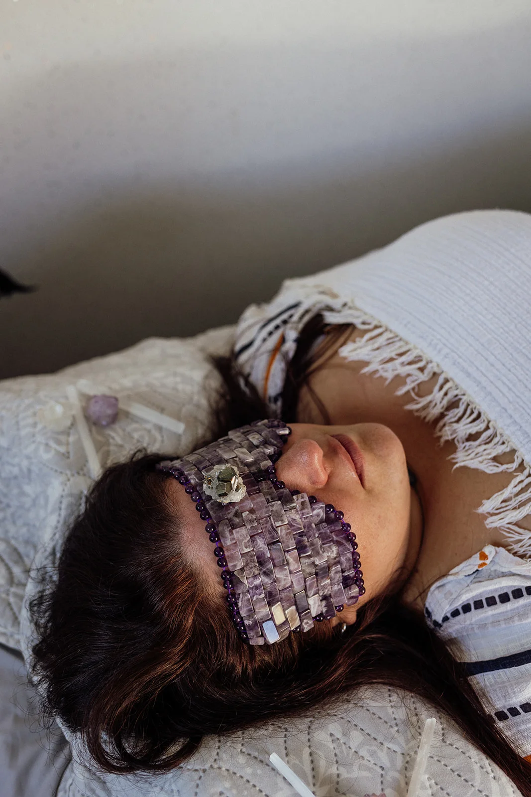 A crystal healing therapy session with a client relaxing